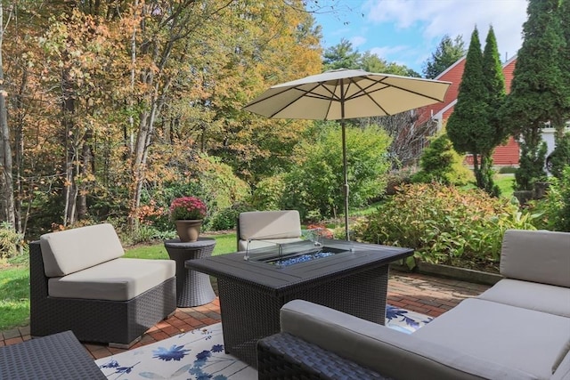 deck featuring an outdoor living space with a fire pit and a patio area