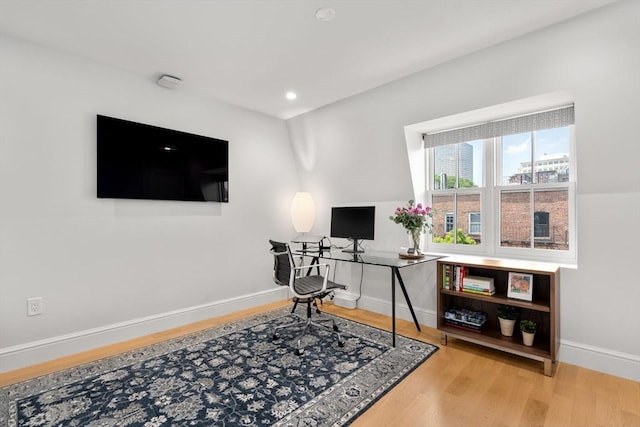 office area with hardwood / wood-style floors