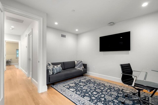 living room with light hardwood / wood-style floors