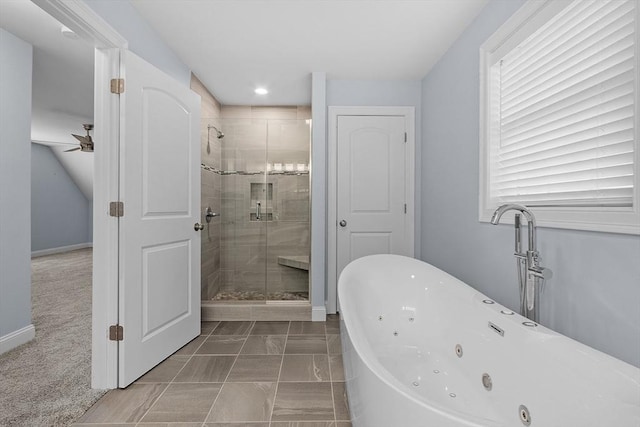 bathroom with tile patterned flooring and separate shower and tub