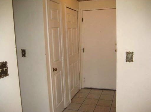 hallway featuring tile patterned floors