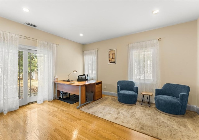 office area with recessed lighting, visible vents, baseboards, and wood finished floors