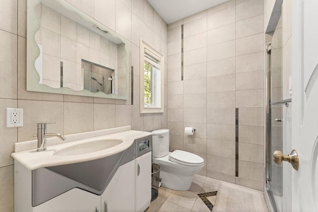 full bathroom featuring vanity, tile walls, toilet, and a stall shower