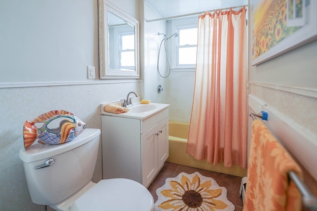 full bathroom with tile patterned flooring, vanity, toilet, and shower / bath combo with shower curtain