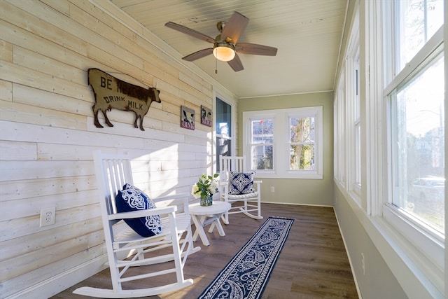 sunroom with ceiling fan and plenty of natural light