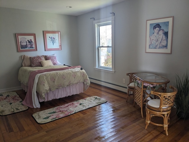 bedroom featuring hardwood / wood-style flooring and baseboard heating