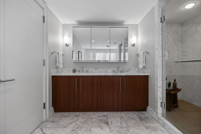 bathroom featuring vanity and an enclosed shower