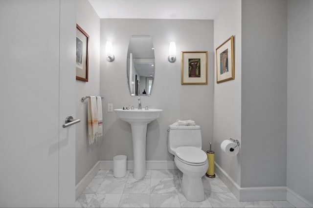 bathroom with toilet and sink