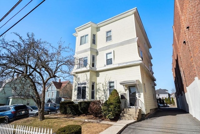 view of front of home with fence