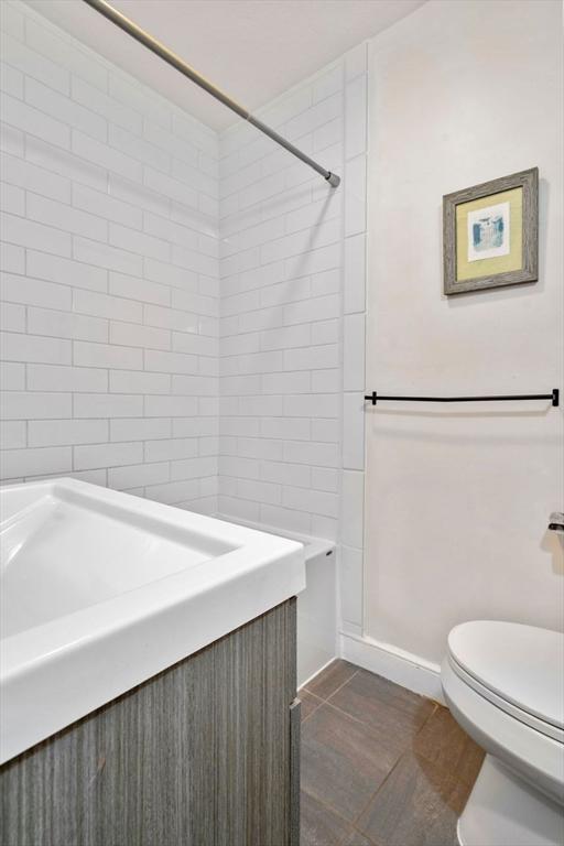 full bath with a shower and toilet