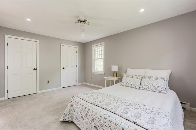 bedroom featuring light colored carpet, baseboards, and recessed lighting