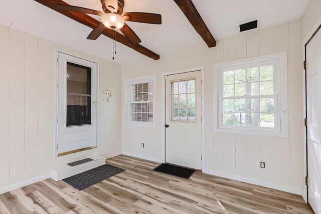 entryway featuring light wood-type flooring, beamed ceiling, baseboards, and ceiling fan