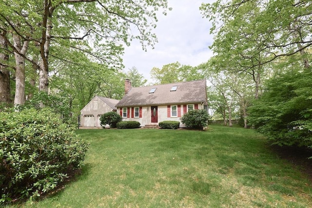 cape cod-style house featuring a chimney and a front yard