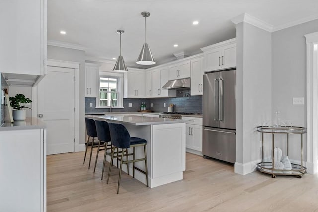 73 Knoll St Unit 73, Boston, MA 02131 - kitchen featuring stainless steel appliances, light wood finished floors, ornamental molding, backsplash, and recessed lighting