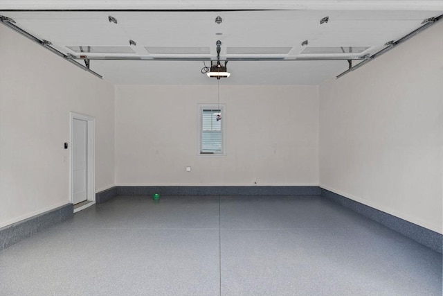 73 Knoll St Unit 73, Boston, MA 02131 - garage with a garage door opener and baseboards