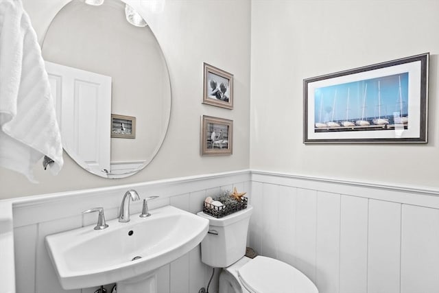 54 Sunflower Way, Plymouth, MA 02360 - bathroom with a sink, toilet, and a wainscoted wall