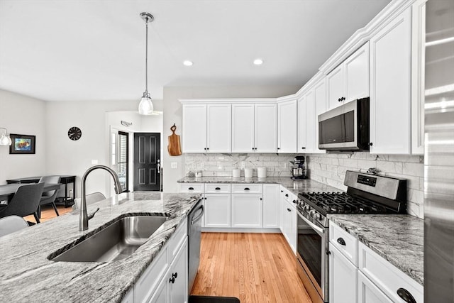 54 Sunflower Way, Plymouth, MA 02360 - kitchen featuring appliances with stainless steel finishes, a sink, white cabinets, and recessed lighting