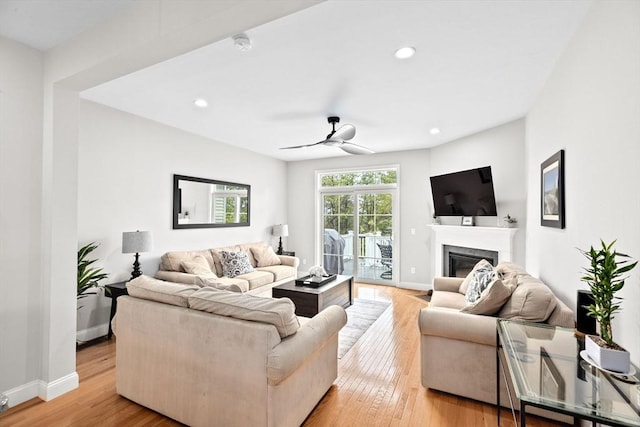 54 Sunflower Way, Plymouth, MA 02360 - living room with a glass covered fireplace, a ceiling fan, light wood-type flooring, baseboards, and recessed lighting