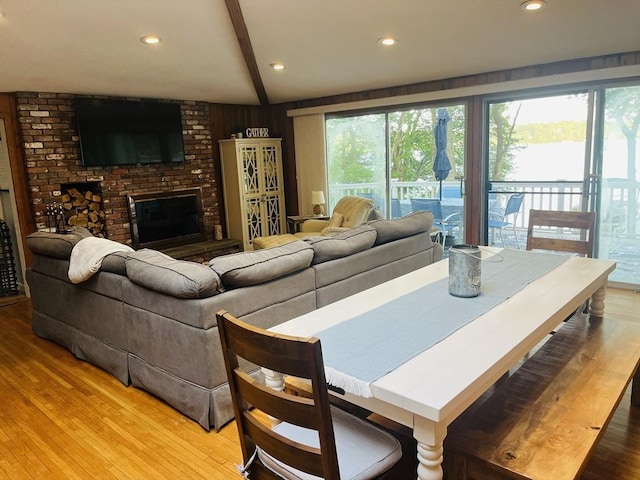 233 Hoopdole Rd, Mashpee, MA 02649 - living room with light wood-type flooring, a brick fireplace, beam ceiling, and recessed lighting