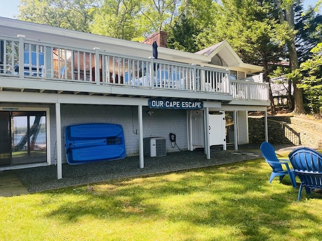 233 Hoopdole Rd, Mashpee, MA 02649 - rear view of house with a lawn and a chimney