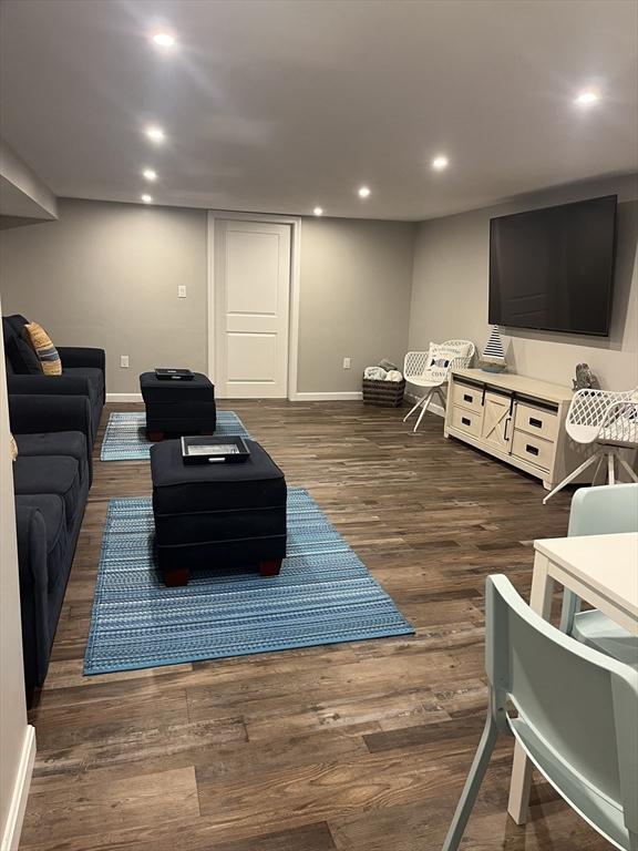 233 Hoopdole Rd, Mashpee, MA 02649 - living area with dark wood finished floors and recessed lighting