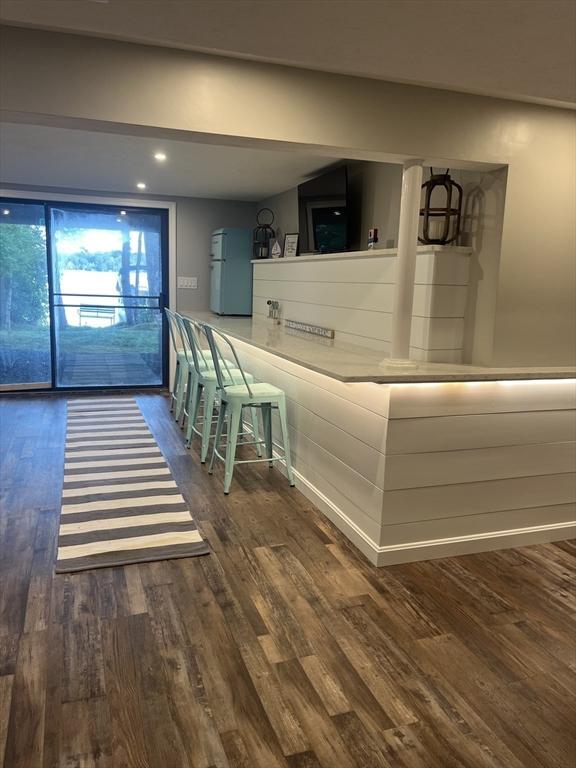 233 Hoopdole Rd, Mashpee, MA 02649 - bar area featuring freestanding refrigerator, wood finished floors, and recessed lighting