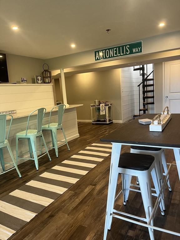 233 Hoopdole Rd, Mashpee, MA 02649 - dining area with dark wood-type flooring, stairway, and recessed lighting