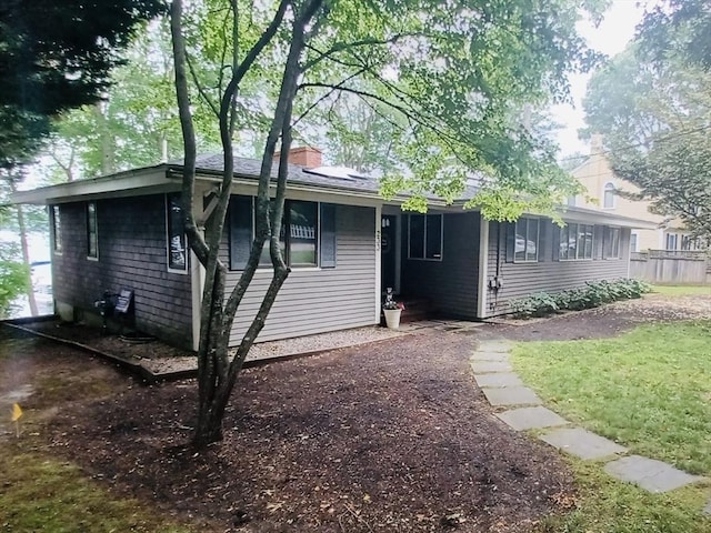233 Hoopdole Rd, Mashpee, MA 02649 - view of front of house featuring a chimney and a front lawn