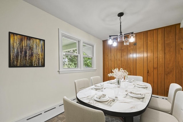 35 Woodland Rd, Leominster, MA 01453 - dining room featuring a baseboard heating unit, wooden walls, and a chandelier