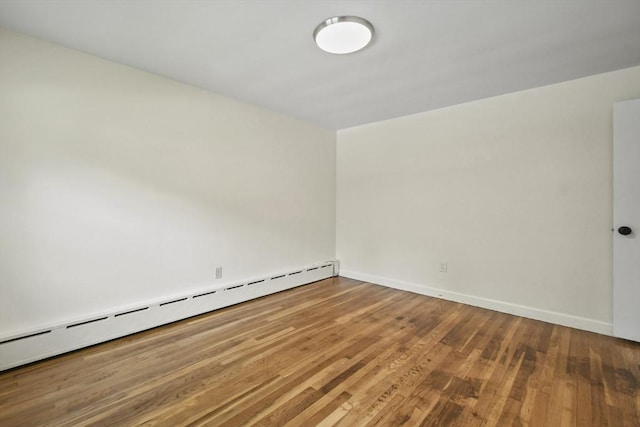 35 Woodland Rd, Leominster, MA 01453 - unfurnished room featuring baseboard heating and wood finished floors