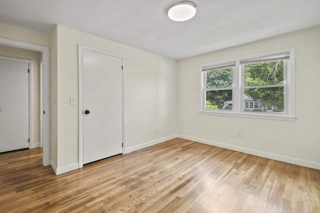 35 Woodland Rd, Leominster, MA 01453 - unfurnished bedroom with wood finished floors and baseboards