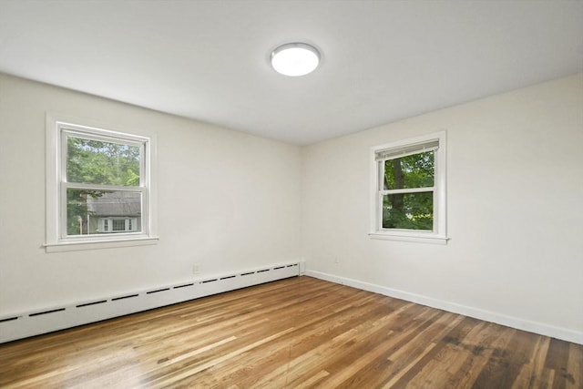 35 Woodland Rd, Leominster, MA 01453 - spare room with a baseboard radiator, healthy amount of natural light, and wood finished floors