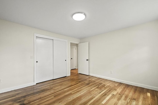 35 Woodland Rd, Leominster, MA 01453 - unfurnished bedroom with wood finished floors and a closet