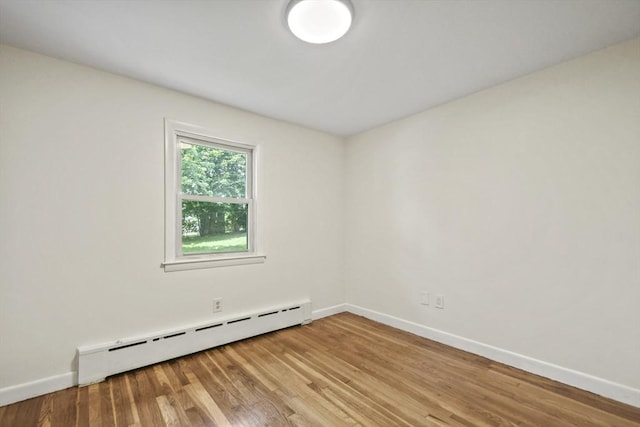 35 Woodland Rd, Leominster, MA 01453 - unfurnished room featuring a baseboard radiator and light wood-type flooring