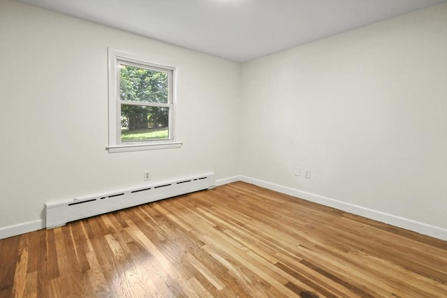 35 Woodland Rd, Leominster, MA 01453 - spare room featuring a baseboard heating unit and light wood-style flooring