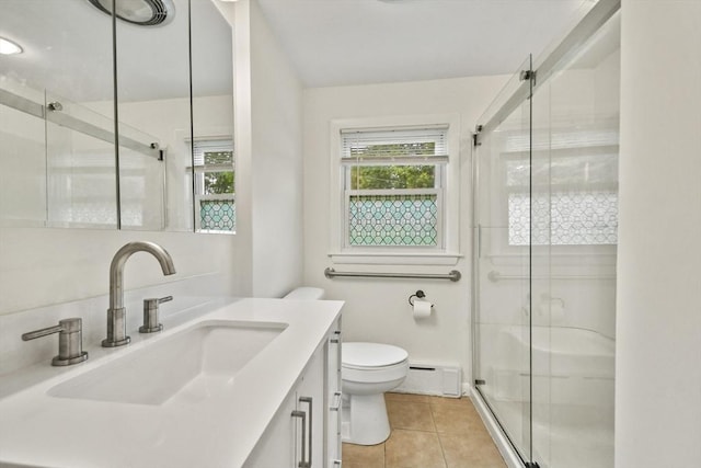 35 Woodland Rd, Leominster, MA 01453 - bathroom featuring a baseboard heating unit, vanity, tile patterned floors, and a shower stall