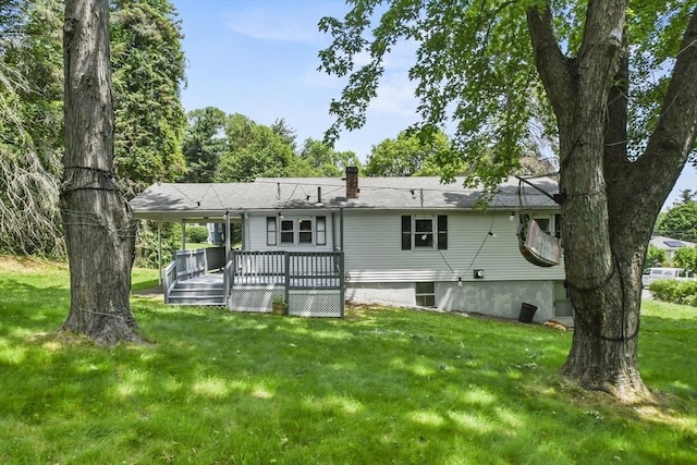 35 Woodland Rd, Leominster, MA 01453 - back of house featuring a yard, a deck, and a chimney