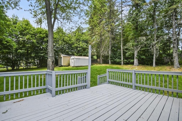 35 Woodland Rd, Leominster, MA 01453 - wooden deck featuring a storage unit and a fenced backyard