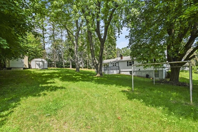 35 Woodland Rd, Leominster, MA 01453 - view of grassy yard with a storage unit