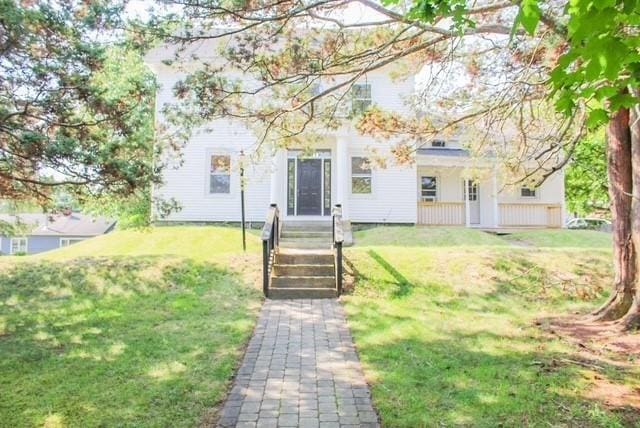68 Forest St, Lowell, MA 01851 - view of front facade featuring a front lawn