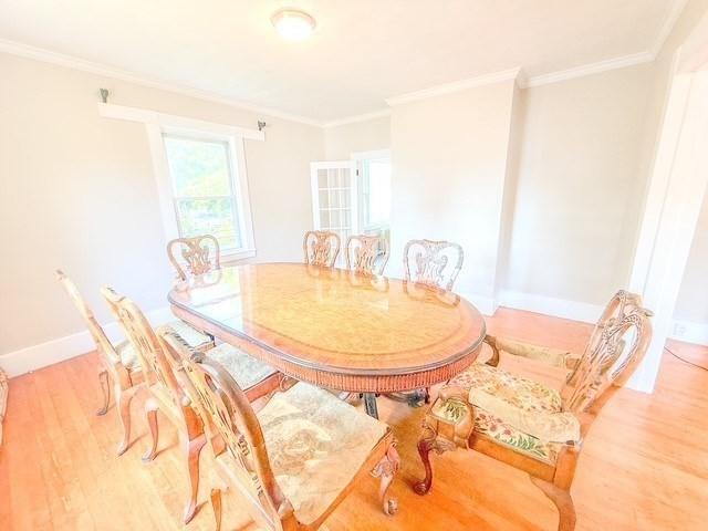 68 Forest St, Lowell, MA 01851 - dining space with crown molding and light wood finished floors