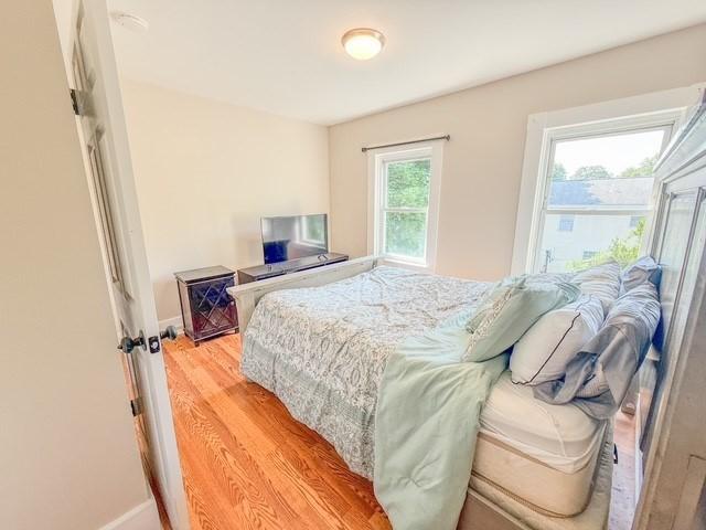 68 Forest St, Lowell, MA 01851 - bedroom featuring baseboards and light wood-style floors