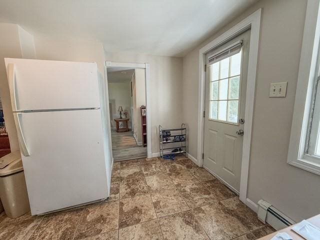 68 Forest St, Lowell, MA 01851 - kitchen featuring freestanding refrigerator and a baseboard radiator