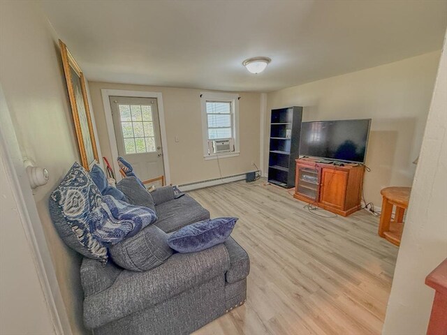 68 Forest St, Lowell, MA 01851 - living area with a baseboard heating unit, light wood-type flooring, and cooling unit