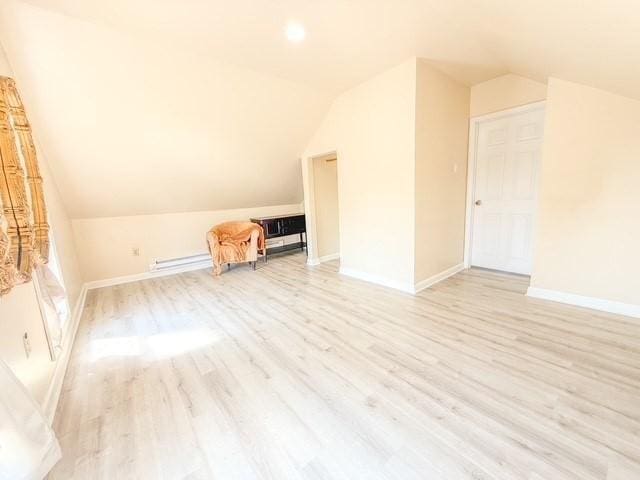 68 Forest St, Lowell, MA 01851 - bonus room with vaulted ceiling, light wood-type flooring, and baseboard heating