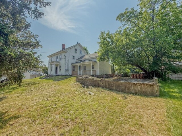 68 Forest St, Lowell, MA 01851 - back of house with a yard and a chimney
