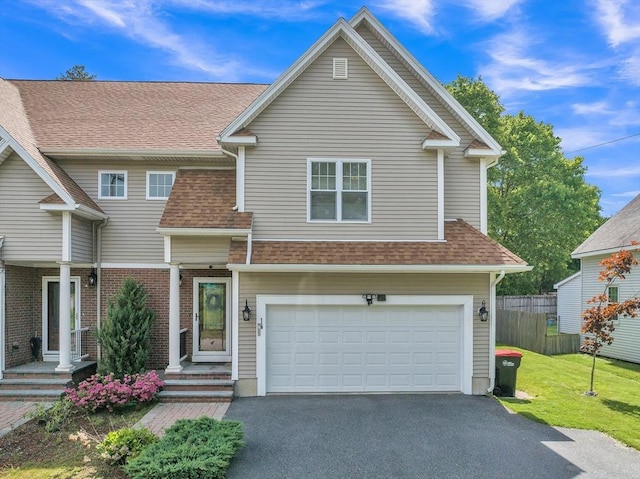 1 Oakes St Unit B, Millbury, MA 01527 - view of front facade featuring a garage, asphalt driveway, and roof with shingles