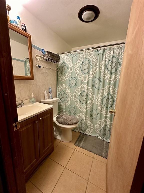 334 Howard St Unit 5, Lawrence, MA 01841 - bathroom with tile patterned flooring, vanity, backsplash, curtained shower, and tile walls