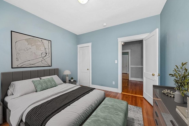 bedroom with hardwood / wood-style floors