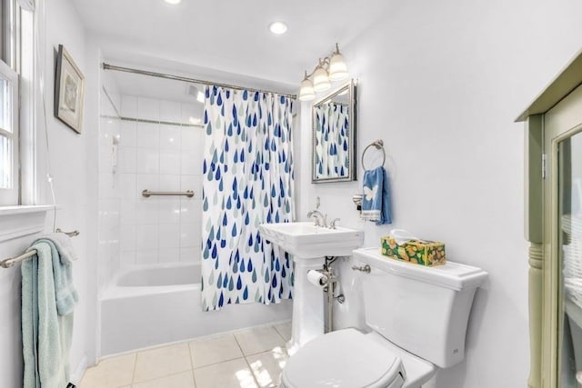 bathroom featuring tile patterned flooring, toilet, and shower / bath combo